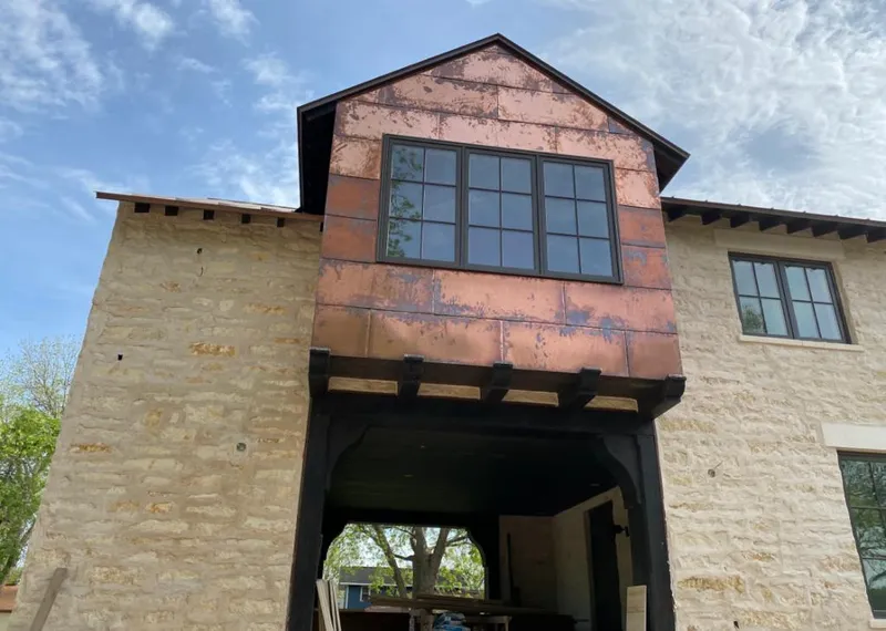 Copper metal panel facade on a stone building for Metal Roof Coating in Newington