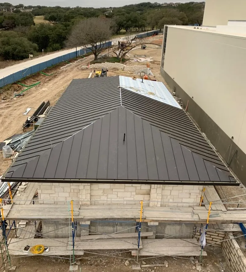 Metal roof new construction with scaffolding in Newington